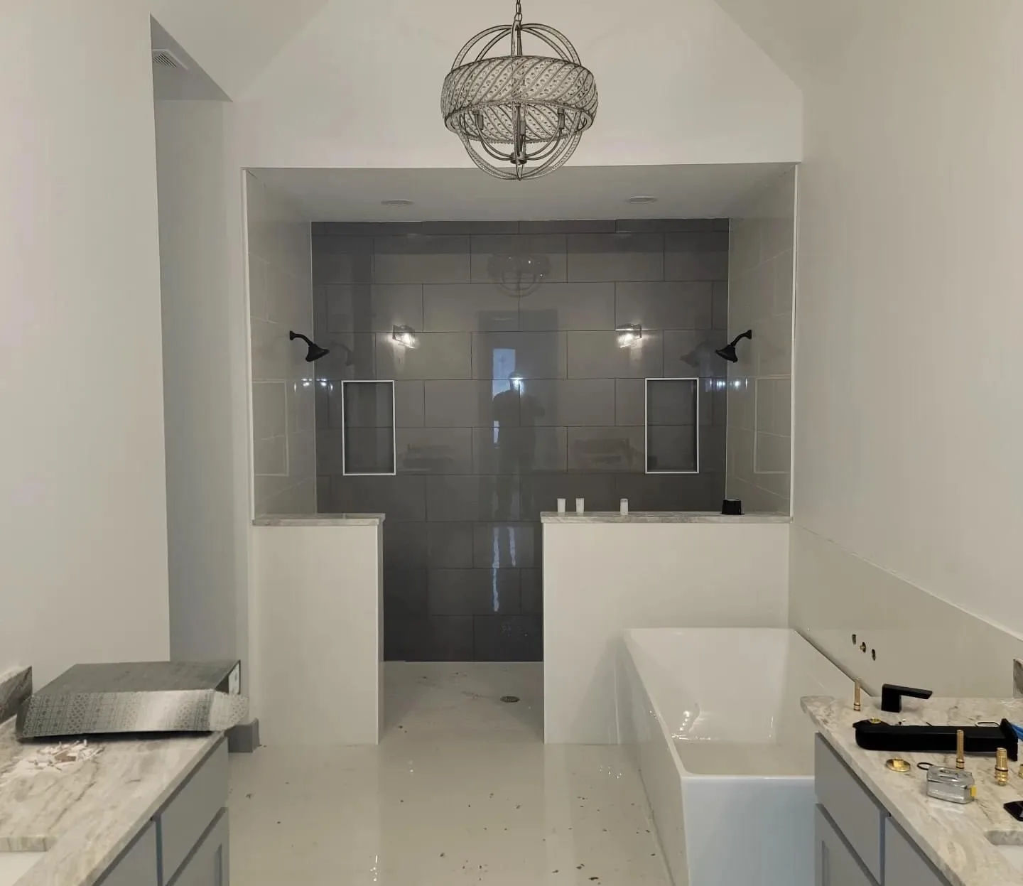 Remodeled bathroom with a tiled walk-in shower and a soaking tub